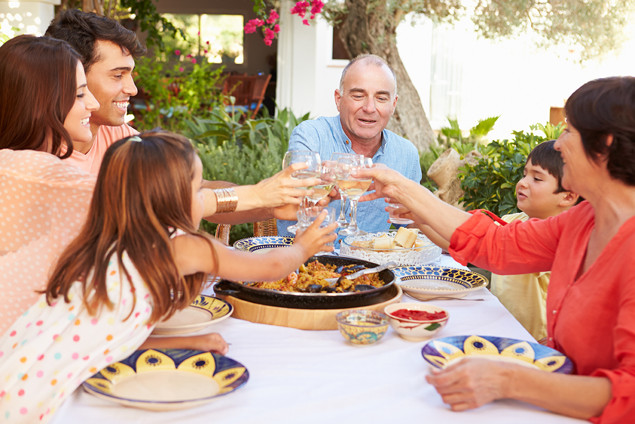 Multi Generation Family Making Toast Before Meal Together